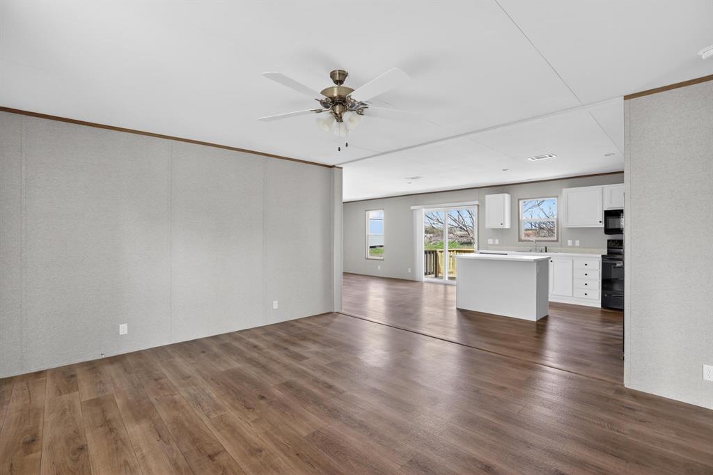 206 Rhett Court Aurora, TX 76078 - Photo 18 of 40 a view of kitchen with granite countertop cabinets and refrigerator