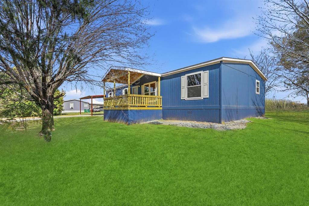 206 Rhett Court Aurora, TX 76078 - Photo 2 of 40 a front view of a house with a yard