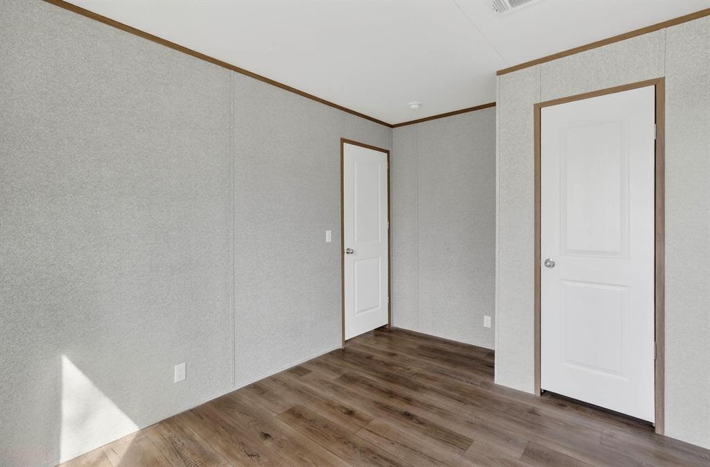 206 Rhett Court Aurora, TX 76078 - Photo 30 of 40 a view of empty room with wooden floor