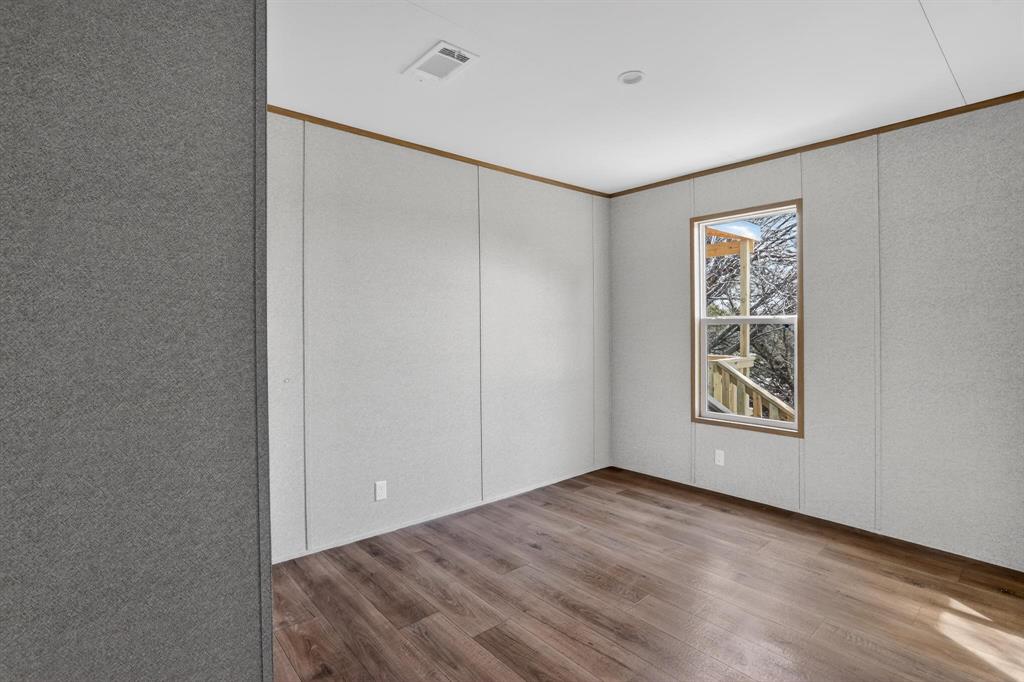 206 Rhett Court Aurora, TX 76078 - Photo 31 of 40 a view of an empty room with a window and closet