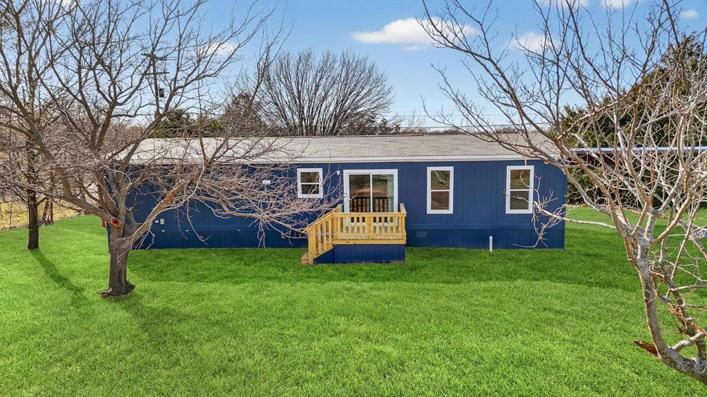 206 Rhett Court Aurora, TX 76078 - Photo 34 of 40 a front view of house with yard and green space