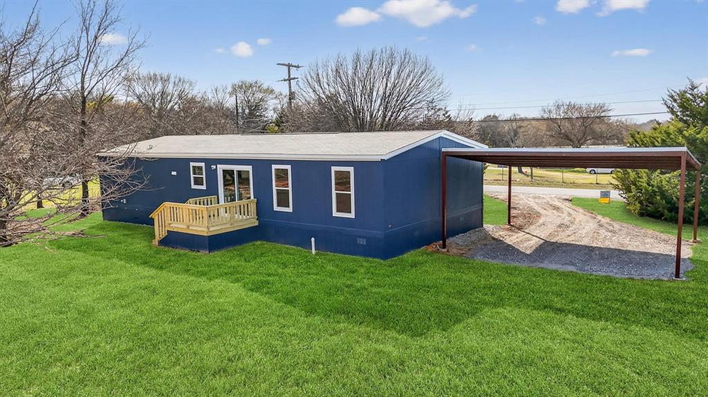 206 Rhett Court Aurora, TX 76078 - Photo 36 of 40 a view of a house with a backyard