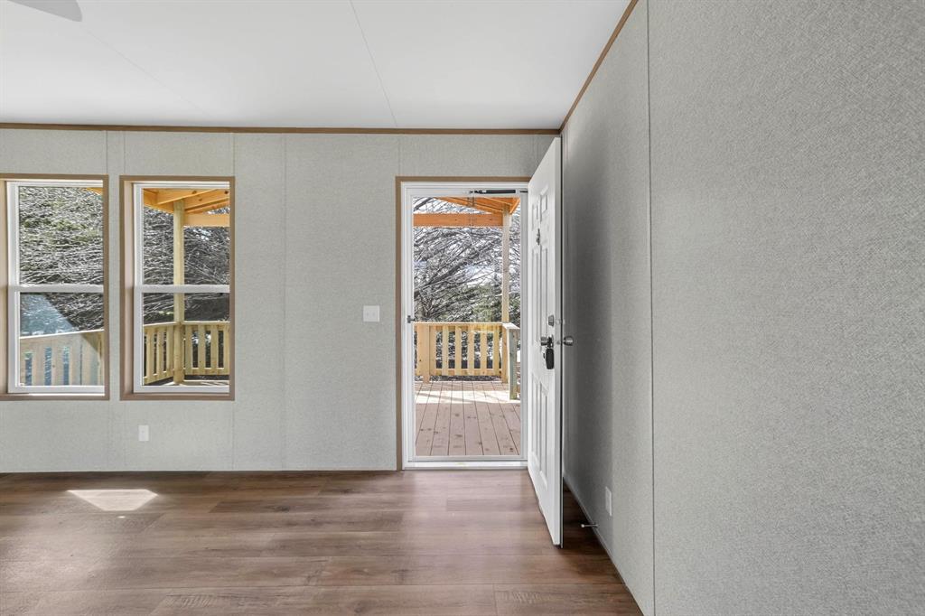 206 Rhett Court Aurora, TX 76078 - Photo 5 of 40 a view of an entryway with wooden floor