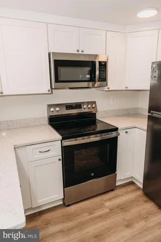 a kitchen with a stove and a microwave