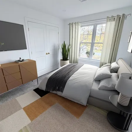 a bedroom with a bed and window