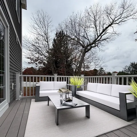 a view of balcony with furniture