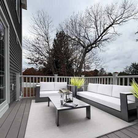 a view of balcony with furniture