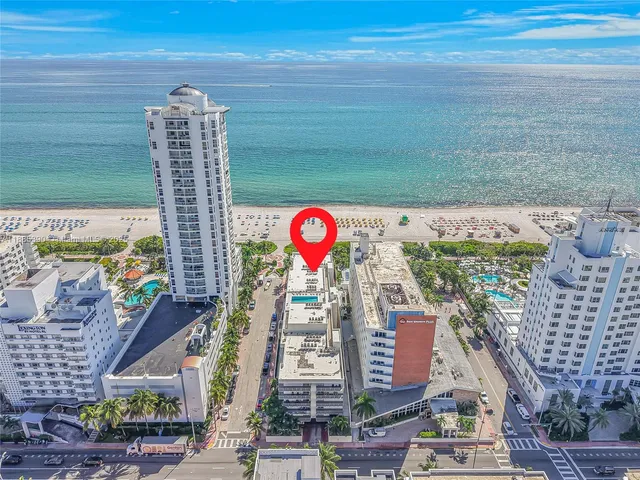 a view of a balcony with wooden floor