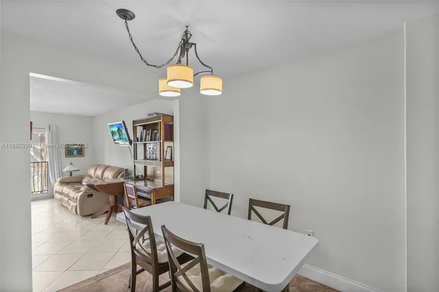 a bathroom with a granite countertop sink a toilet a mirror and shower