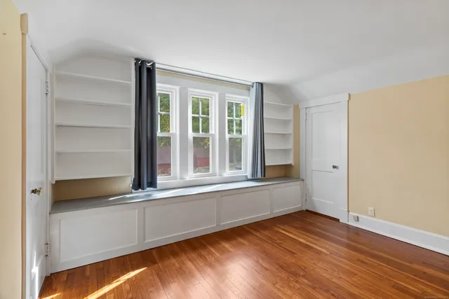 a bathroom with a shower a sink and a mirror