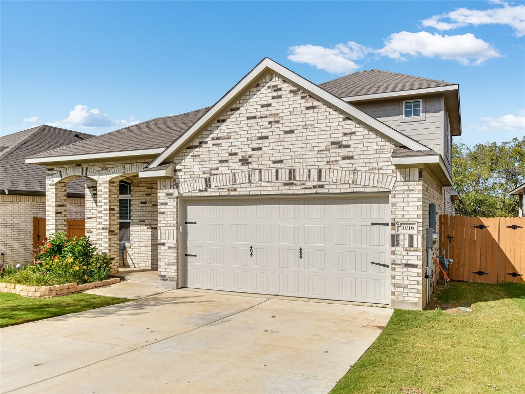 1016 Paddock Lane Georgetown, TX 78626 - Photo 2 of 25 front view of a house with a yard