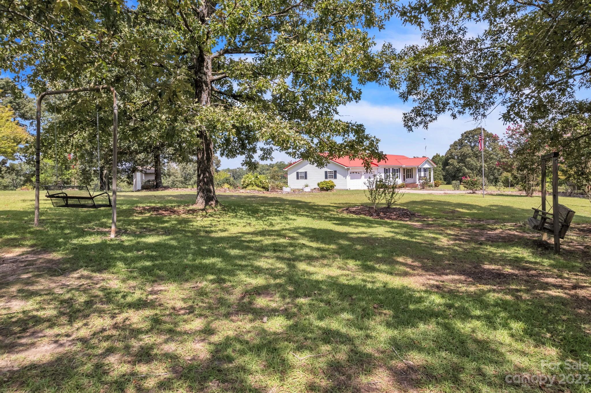 348 West V Thompson Road Rutherfordton, NC 28139 - Photo 27 of 31 a view of a field with a tree