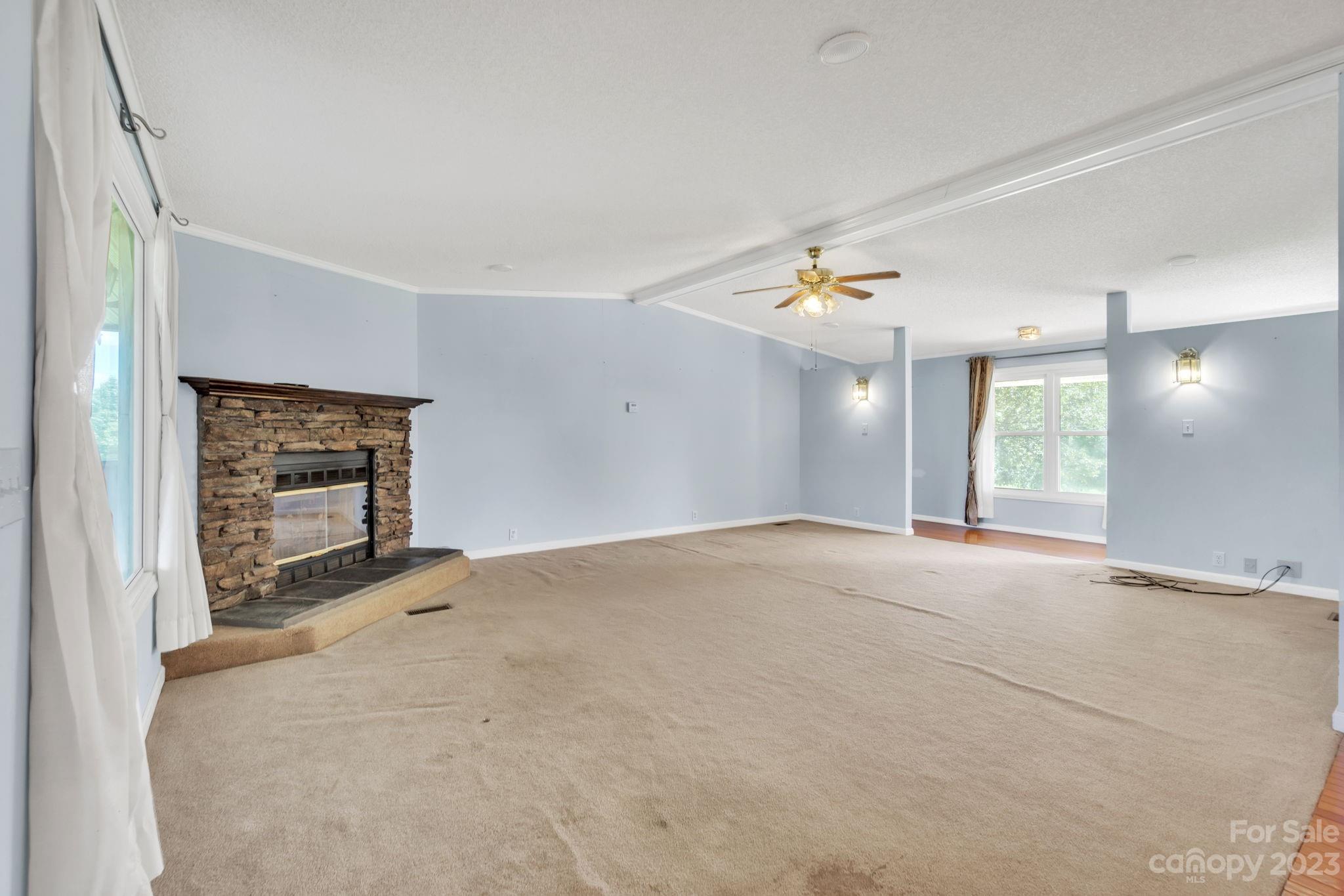 348 West V Thompson Road Rutherfordton, NC 28139 - Photo 5 of 31 a view of an empty room with a window