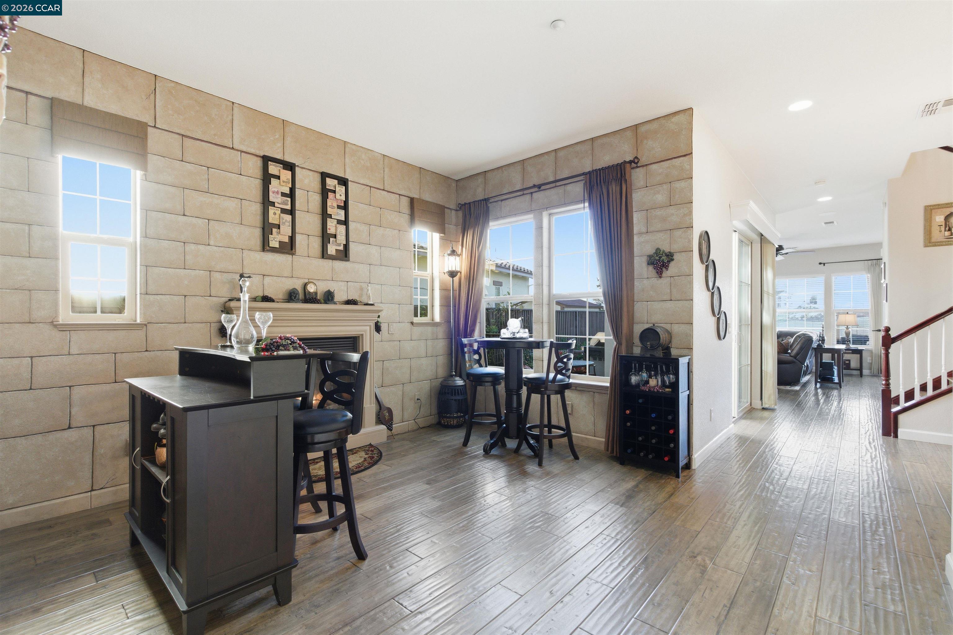 9927 Reimers Way Dublin, CA 94568 - Photo 14 of 39 a dining room with furniture and wooden floor