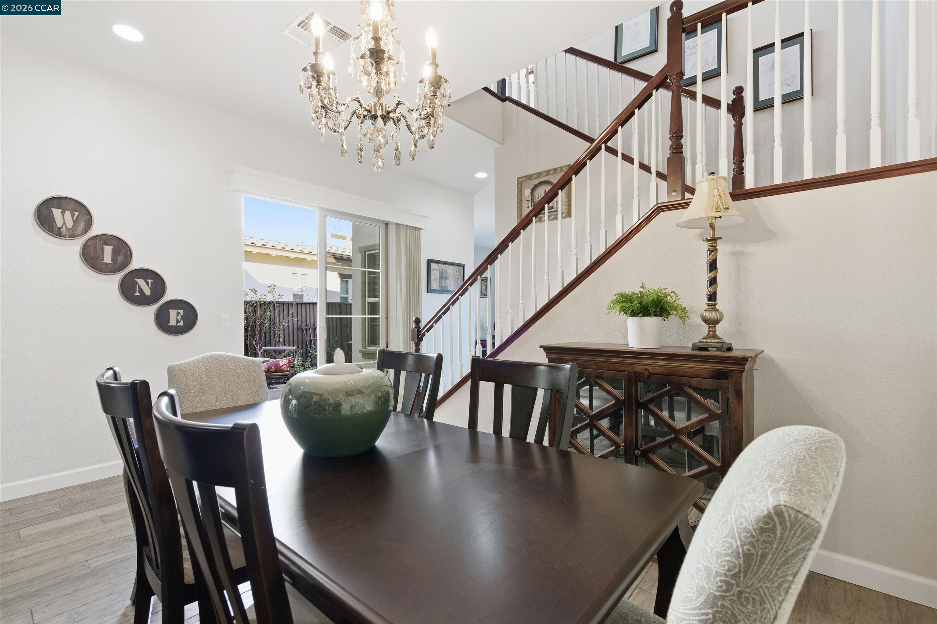 9927 Reimers Way Dublin, CA 94568 - Photo 16 of 39 a view of a dining room with furniture window and wooden floor