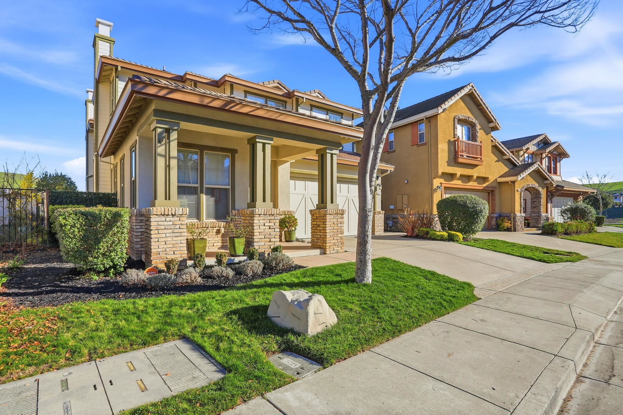 9927 Reimers Way Dublin, CA 94568 - Photo 2 of 39 a front view of a house with garden