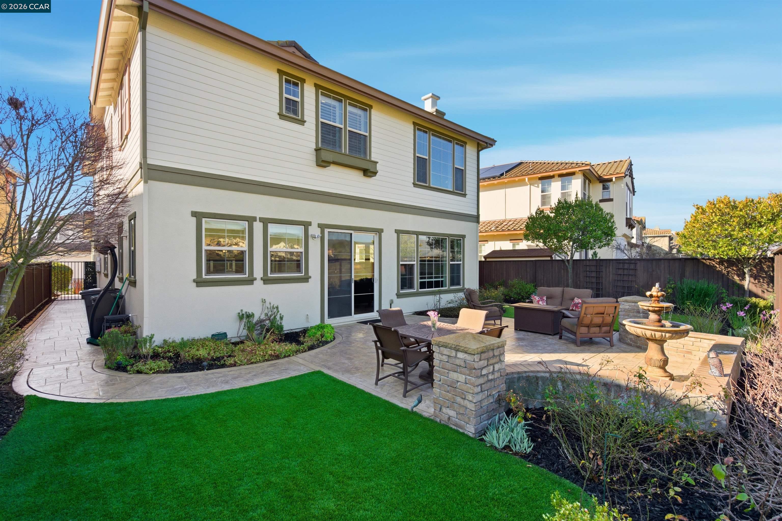 9927 Reimers Way Dublin, CA 94568 - Photo 34 of 39 a view of a house with backyard sitting area and garden