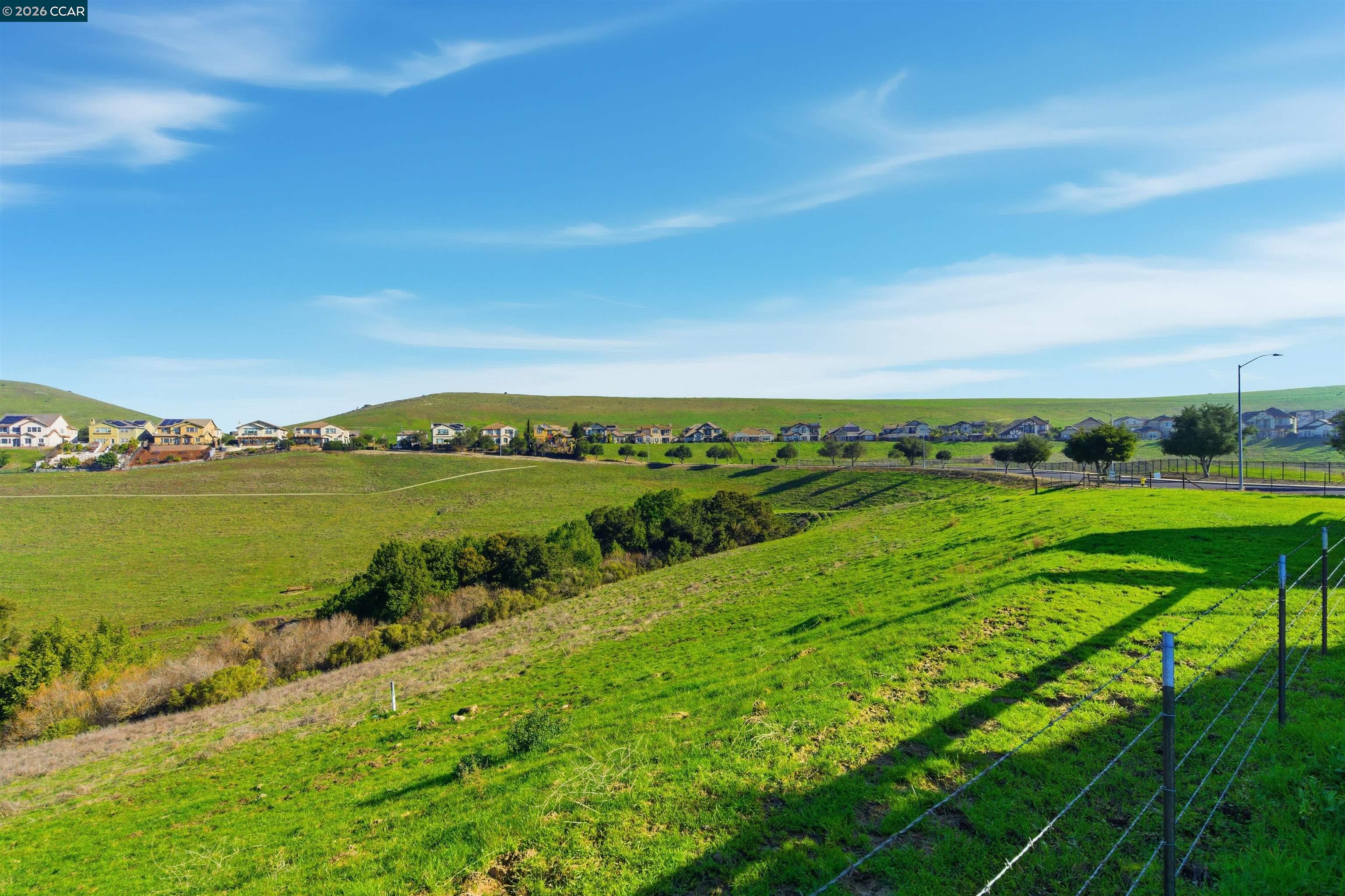9927 Reimers Way Dublin, CA 94568 - Photo 37 of 39 a view of a lake with houses in the back