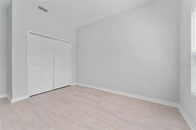 a bathroom with a granite countertop sink a toilet and with a vanity