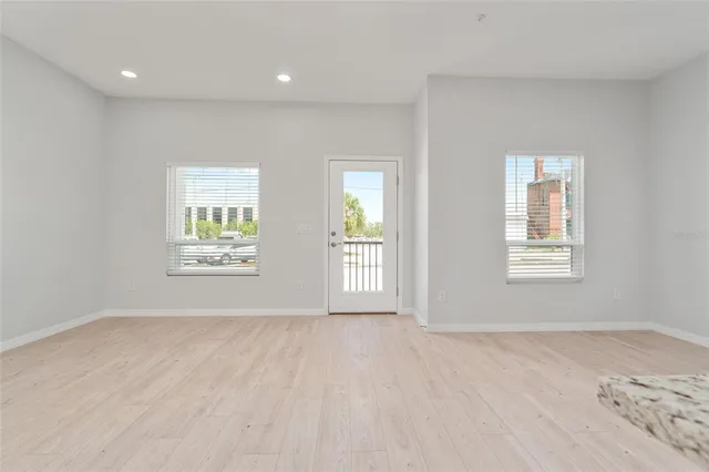 a view of an empty room and a window