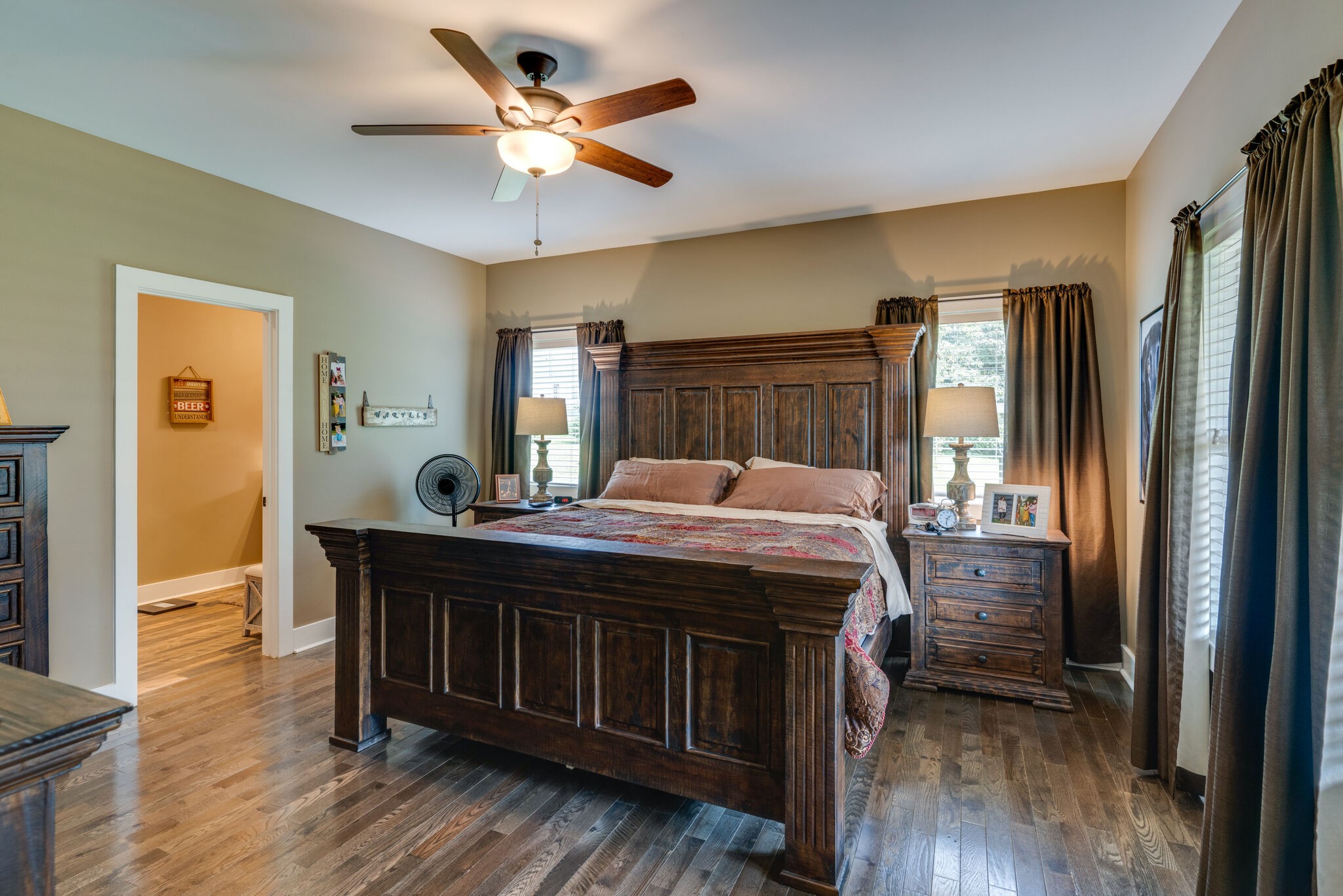 604 Fowler Ford Road Portland, TN 37148 - Photo 14 of 43 a bedroom with a bed and a large mirror with wooden floor