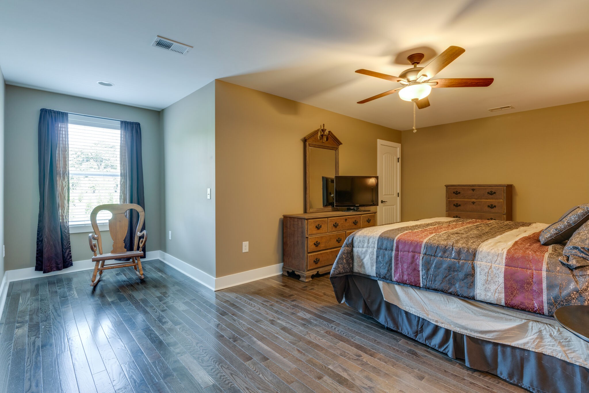 604 Fowler Ford Road Portland, TN 37148 - Photo 27 of 43 a bedroom with a bed and wooden floor