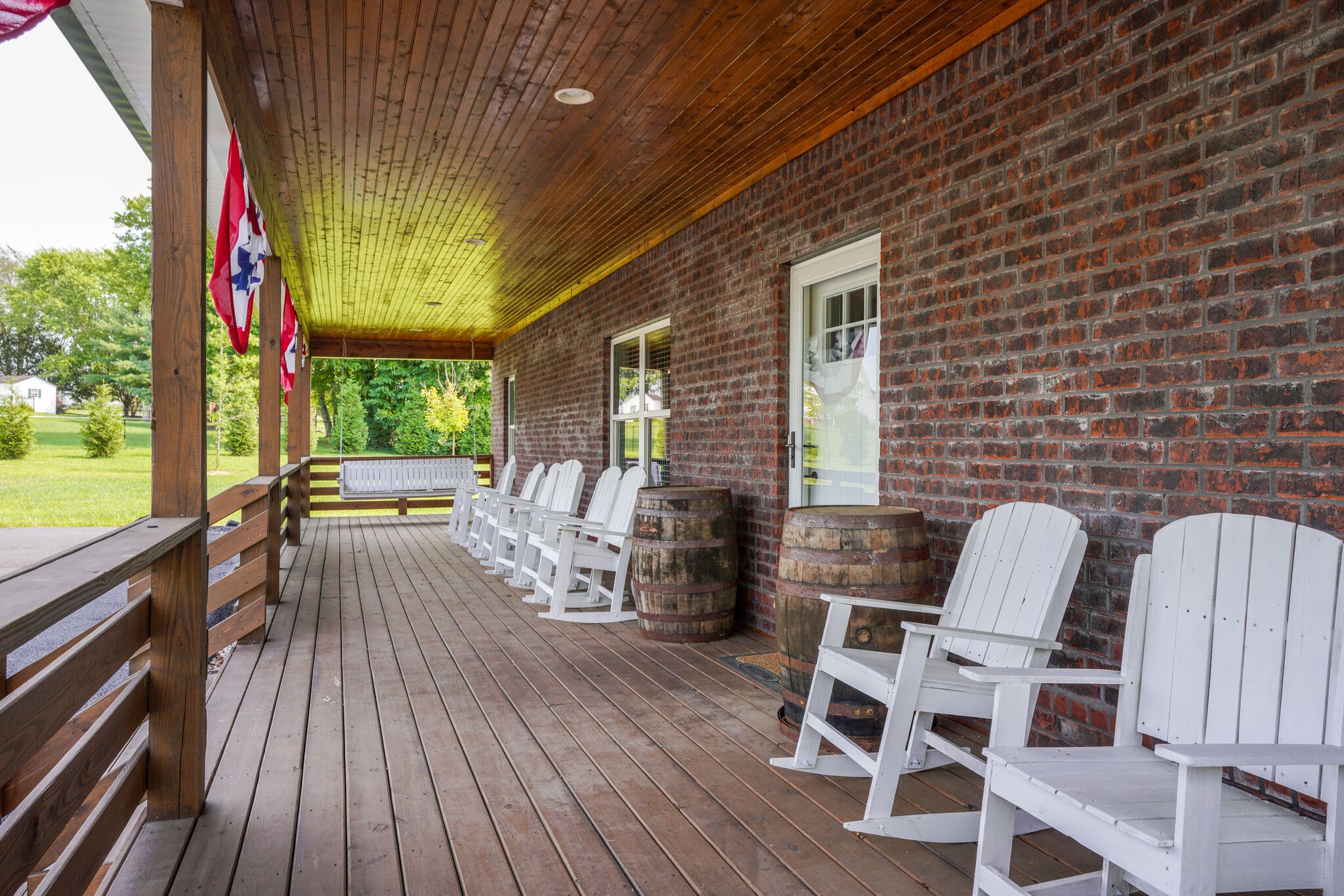 604 Fowler Ford Road Portland, TN 37148 - Photo 4 of 43 a balcony with chairs and wooden floor