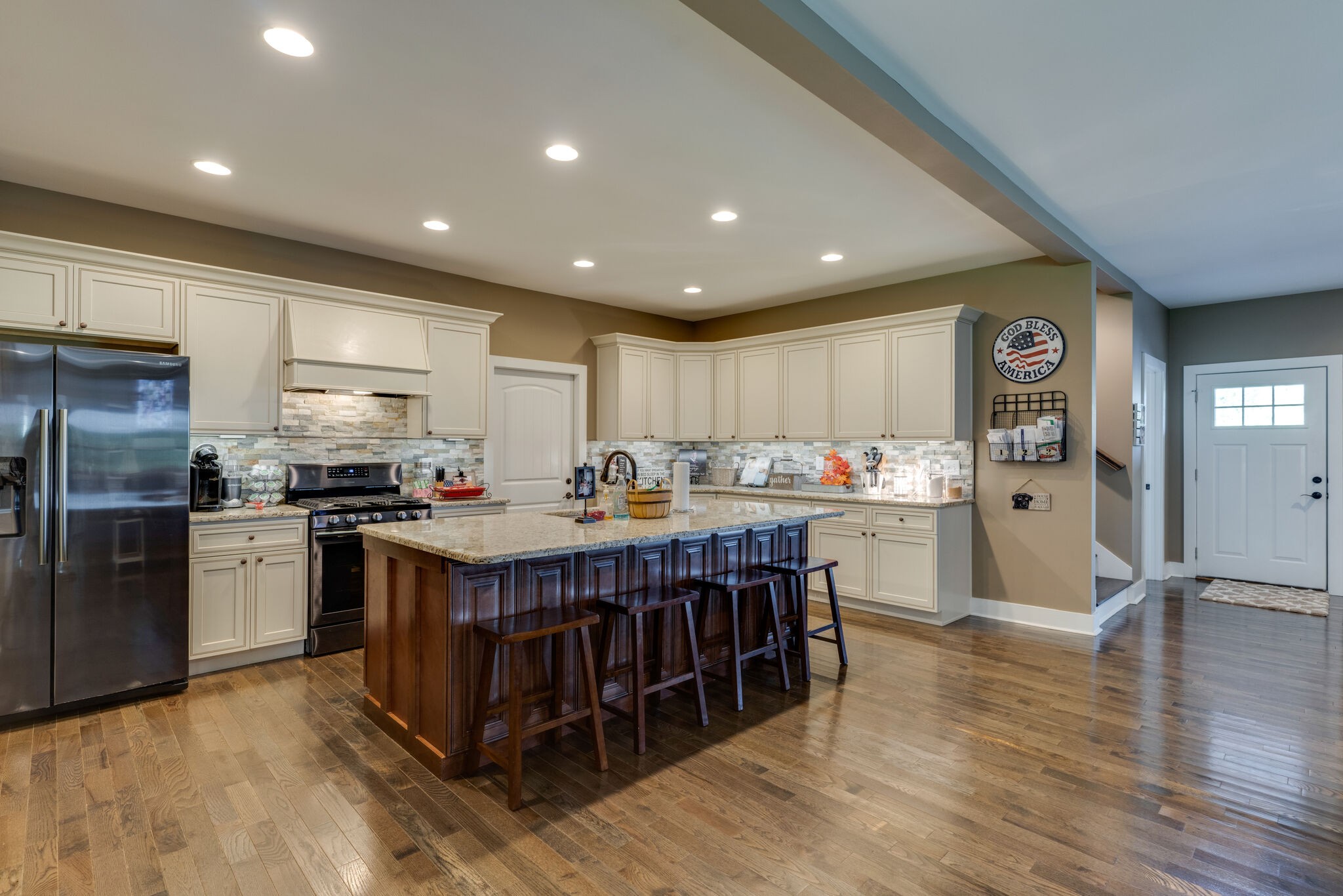 604 Fowler Ford Road Portland, TN 37148 - Photo 10 of 43 a kitchen with kitchen island granite countertop a center island a sink stainless steel appliances and cabinets