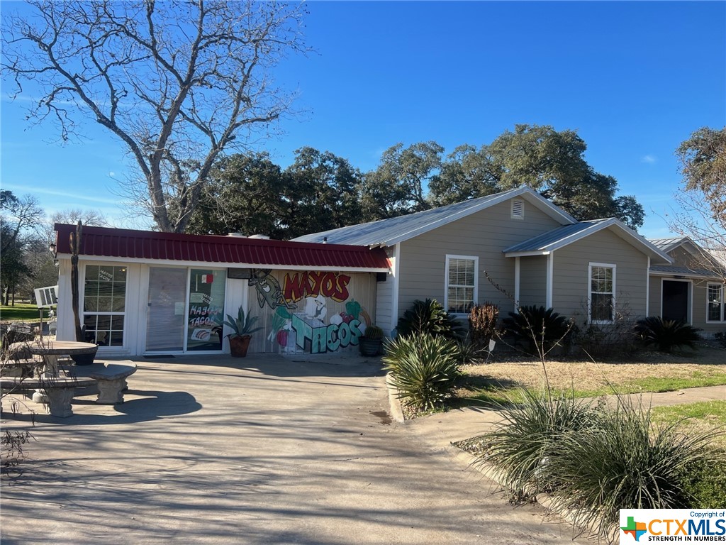 402 Dunn Street Yoakum, TX 77995 - Photo 33 of 48 a view of a house with a yard
