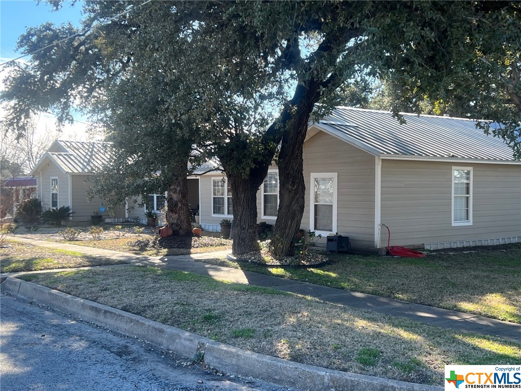 402 Dunn Street Yoakum, TX 77995 - Photo 44 of 48 a front view of a house with garden