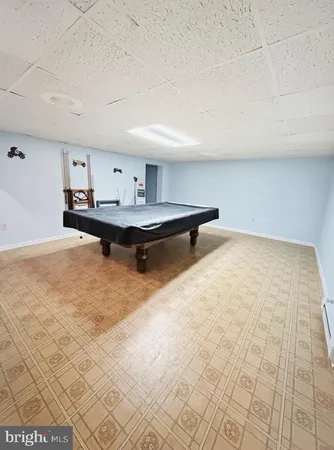 a living room with couches and a large window