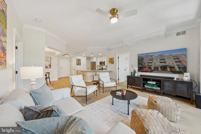 a living room with furniture and fireplace