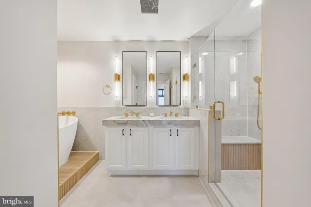 a bathroom with a double vanity sink and mirror