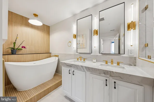 a bathroom with a bathtub and a sink