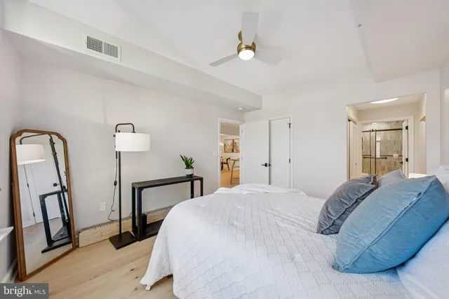 a bedroom with a bed and a dresser