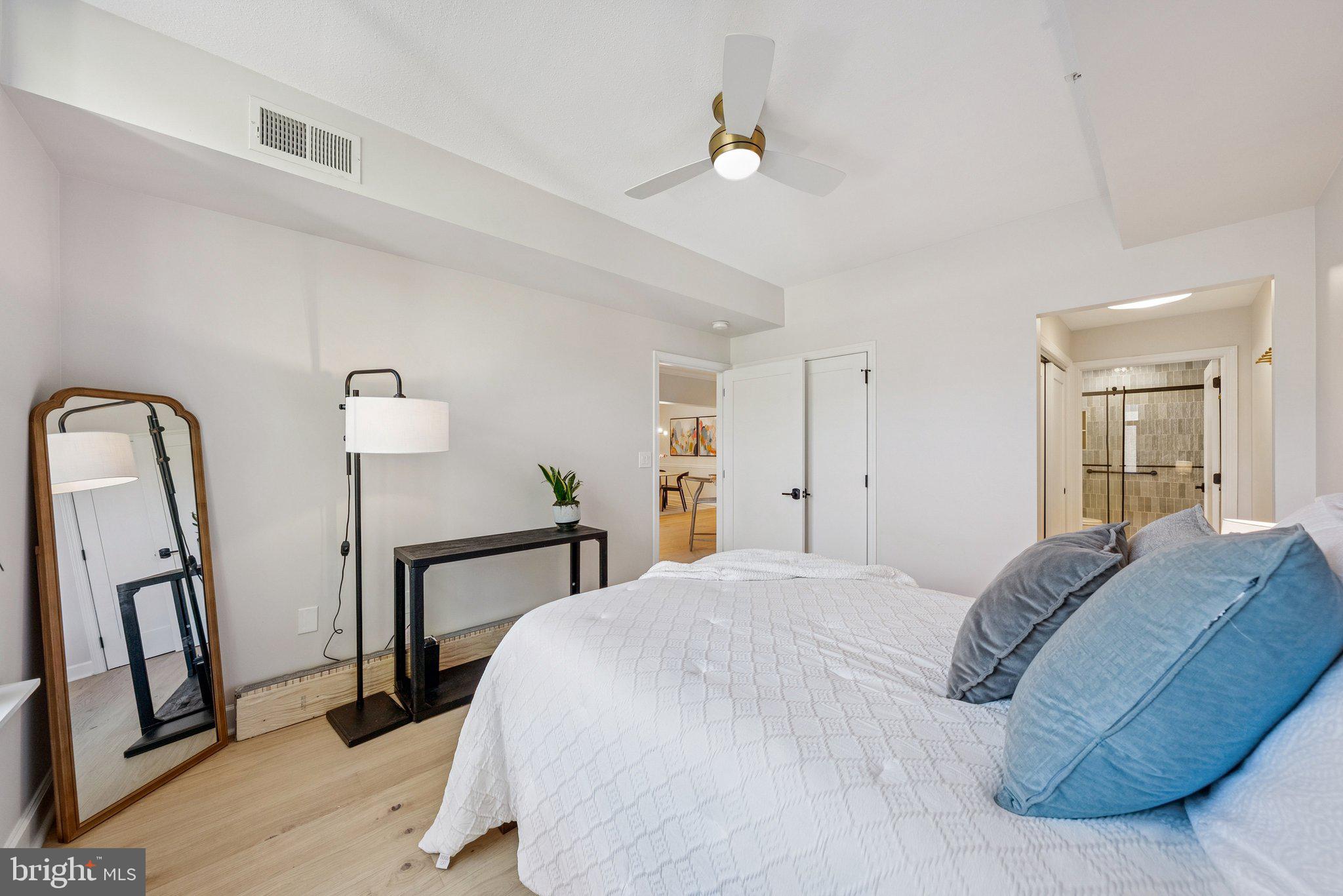 502 West Broad Street, Unit 215 Falls Church, VA 22046 - Photo 30 of 40 a bedroom with a bed and a dresser