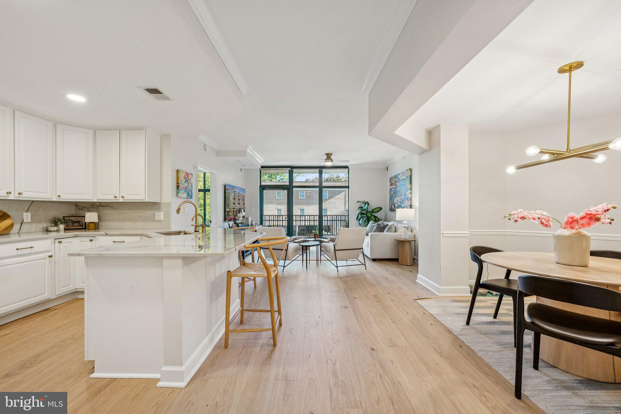 502 West Broad Street, Unit 215 Falls Church, VA 22046 - Photo 3 of 40 a view of a kitchen and dining room
