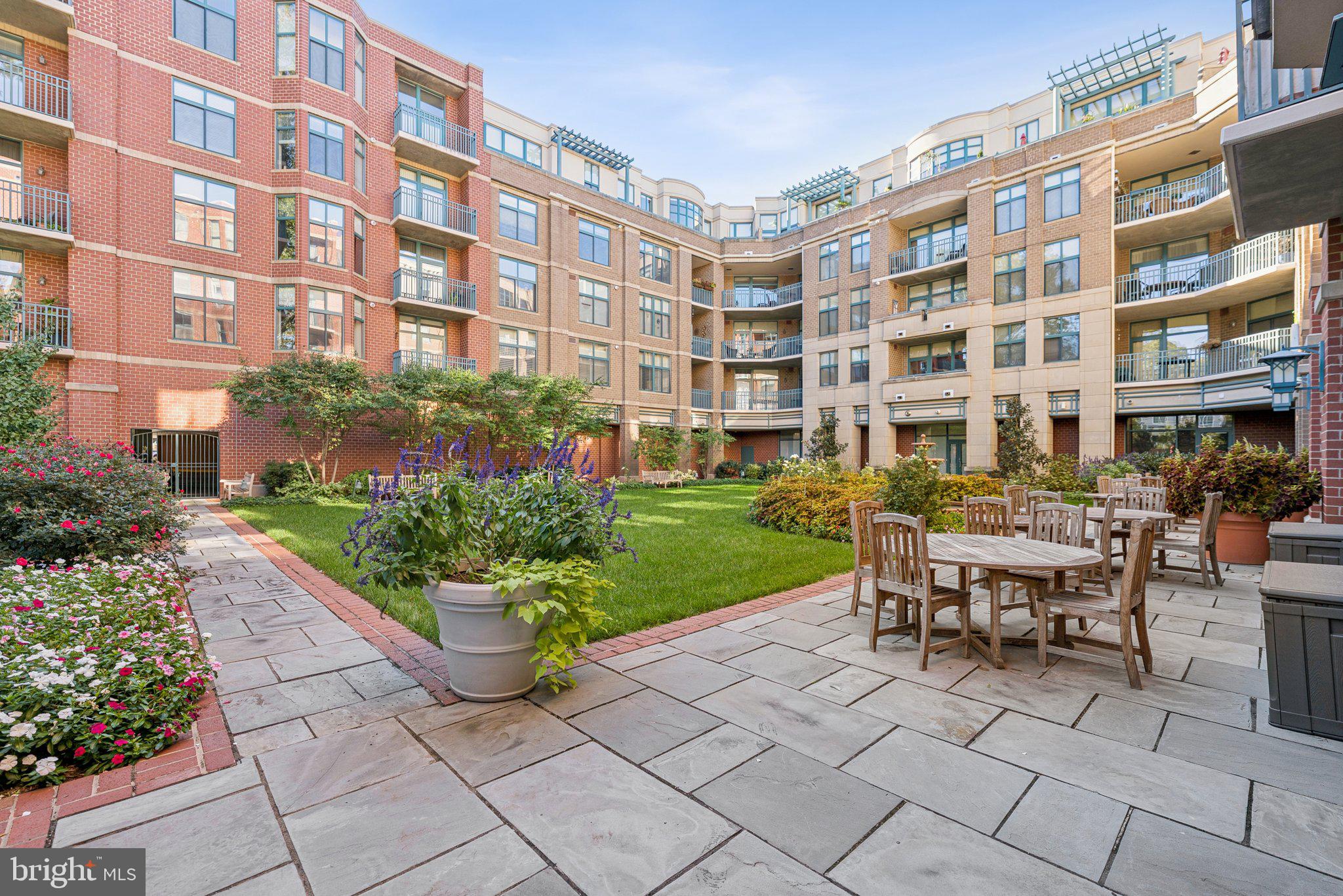 502 West Broad Street, Unit 215 Falls Church, VA 22046 - Photo 34 of 40 a swimming pool with outdoor seating and plants