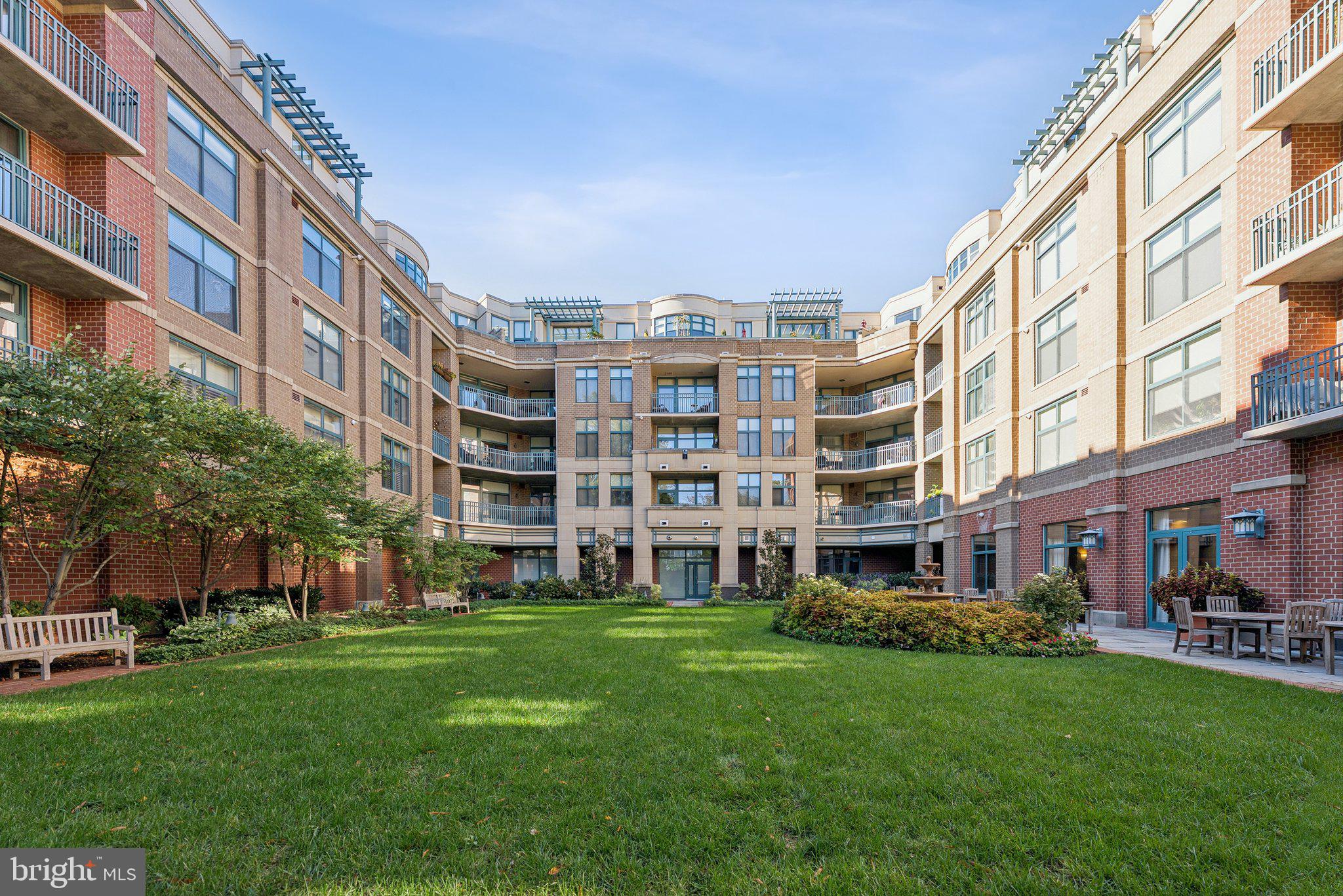 502 West Broad Street, Unit 215 Falls Church, VA 22046 - Photo 38 of 40 a view of an apartment with a garden and plants