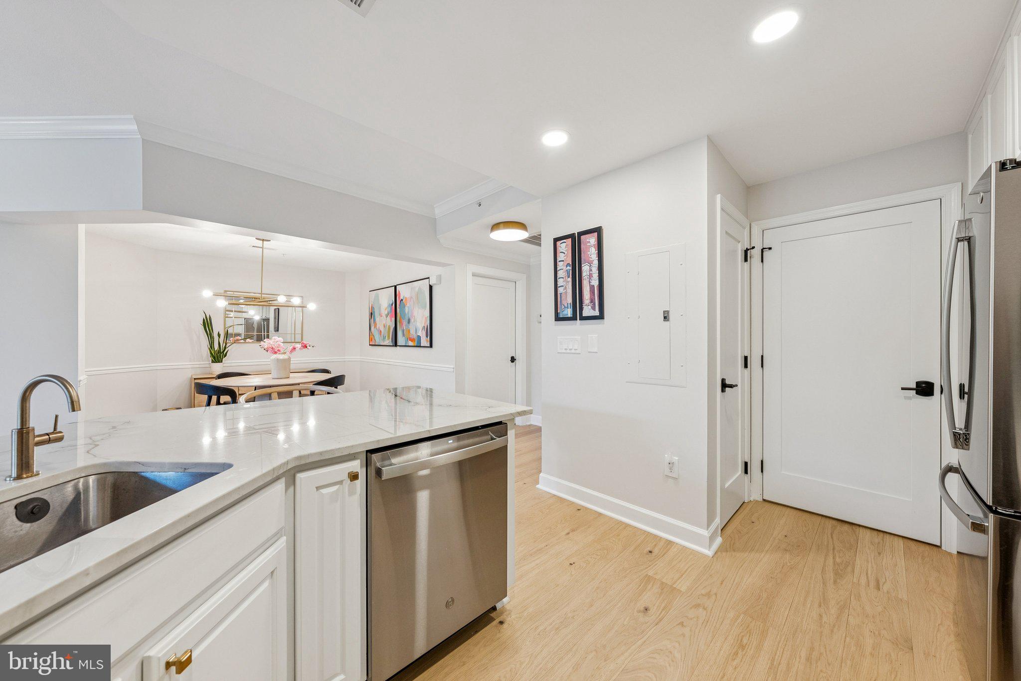 502 West Broad Street, Unit 215 Falls Church, VA 22046 - Photo 8 of 40 a kitchen with a sink cabinets and appliances