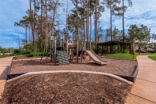 a view of a park with swings