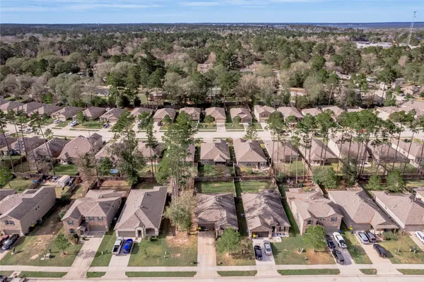 an aerial view of residential houses with outdoor space
