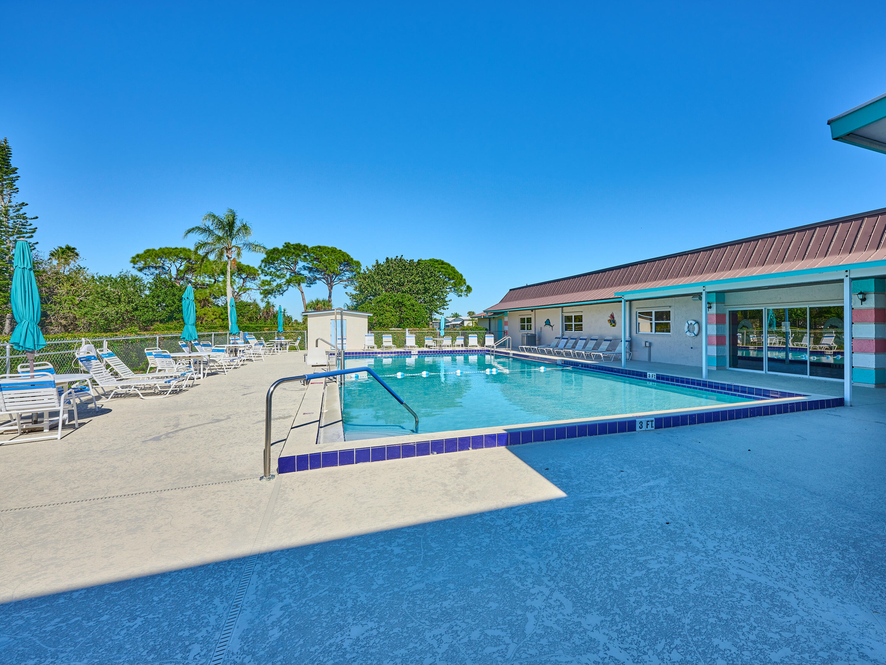 6977 Southeast Delegate Street Hobe Sound, FL 33455 - Photo 57 of 60 swimming pool with outdoor seating