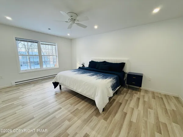 a bedroom with a bed and window