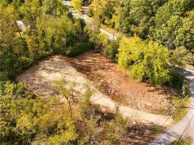 a view of a houses and mountains in the background