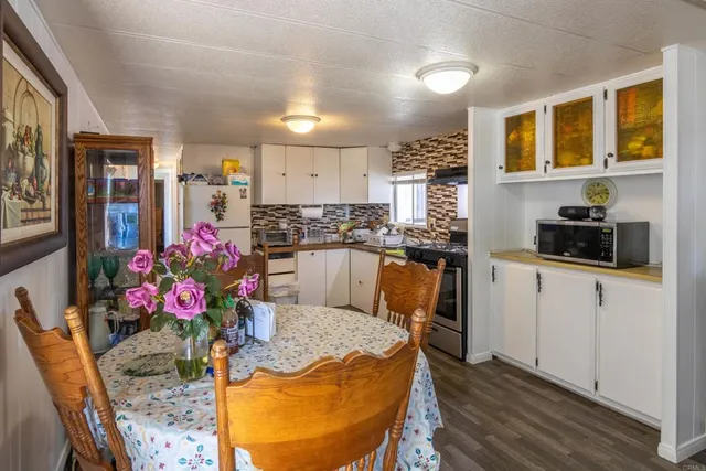 a kitchen with stainless steel appliances granite countertop a kitchen island and cabinets