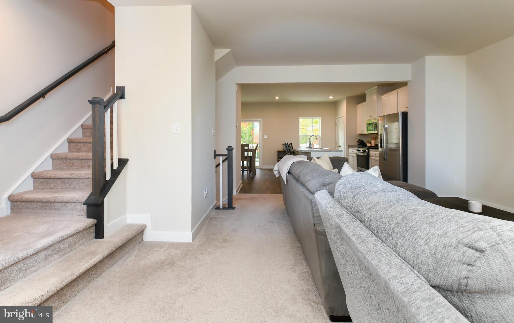 28 Peacock Circle Sewell, NJ 08080 - Photo 3 of 25 a living room with furniture and a large mirror next to a window