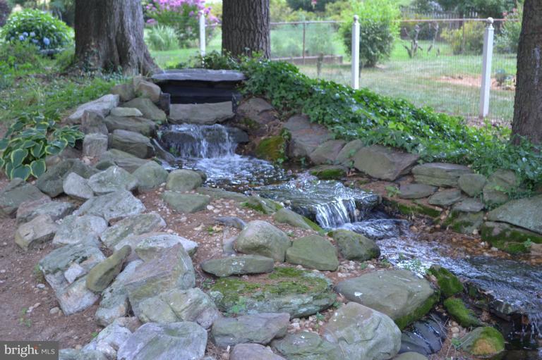 320 Dry Mill Road Southwest Leesburg, VA 20175 - Photo 9 of 10 Tranquil Waterfall Leads to Pond