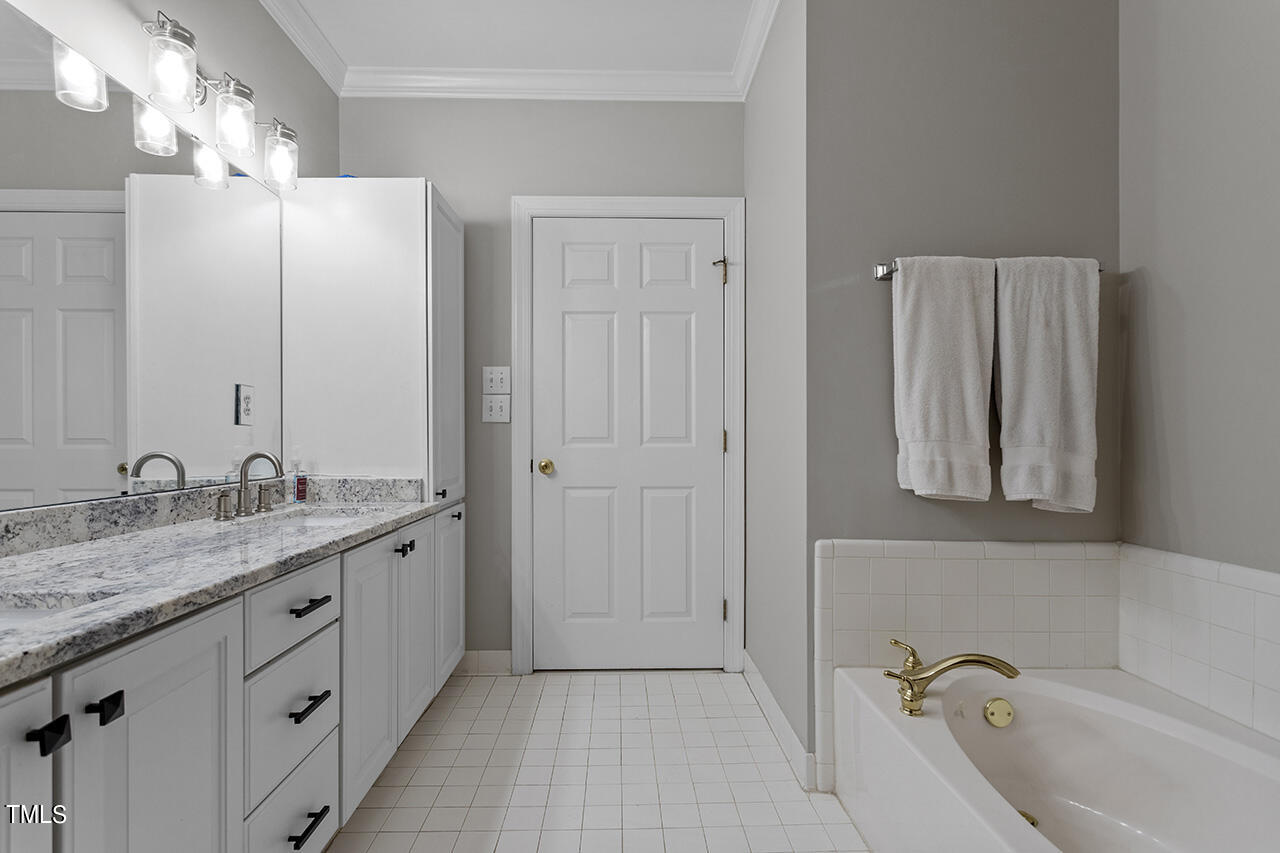 200 South Dawson Street, Unit 203 Raleigh, NC 27601 - Photo 24 of 35 Primary suite
is oversized with 3 closets, double bathroom vanities, shower & soaking bathtub.