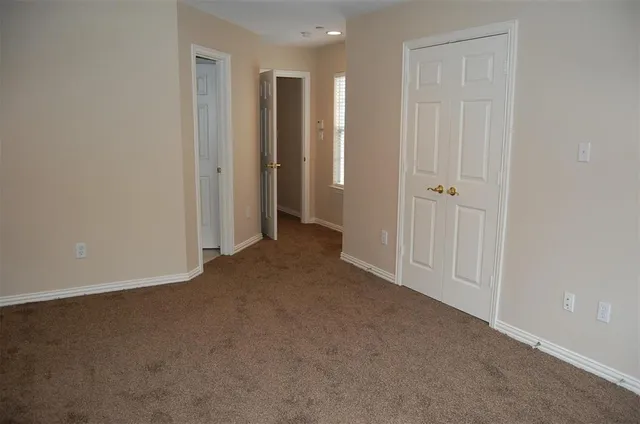 a view of hallway with closet